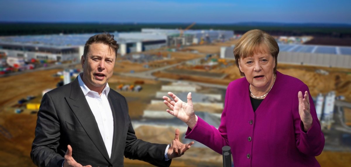 Elon Musk (l.) und Angela Merkel (r.) vor dem Gelände der Tesla Gigafactory Berlin-Brandenburg