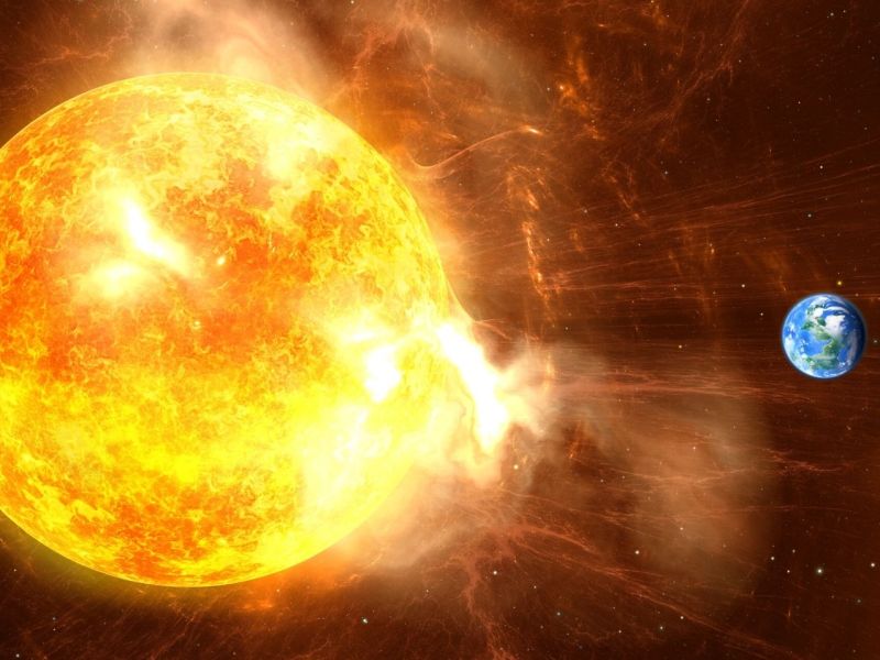 Illustration der Erde neben der Sonne während einer Eruption