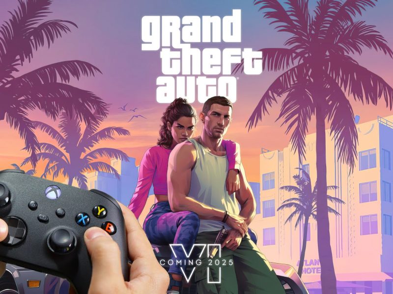 GTA 6 Titelbild. Im Vordergrund sind zwei Hände zu sehen, die einen Xbox-Controller in der Hand halten.